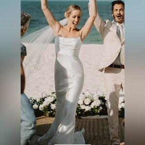 Stunning one of a kind satin wedding gown with thin straps and low back